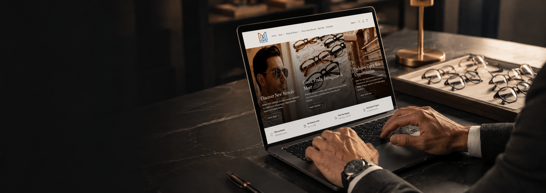 B2B buyer browsing the MJG Trading wholesale eyewear platform on a laptop to place a bulk designer eyewear order