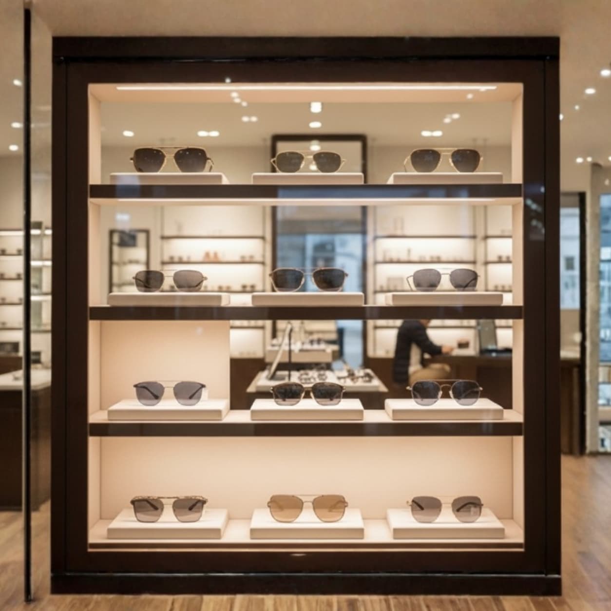 Independent optical store sunglasses display case with designer eyewear